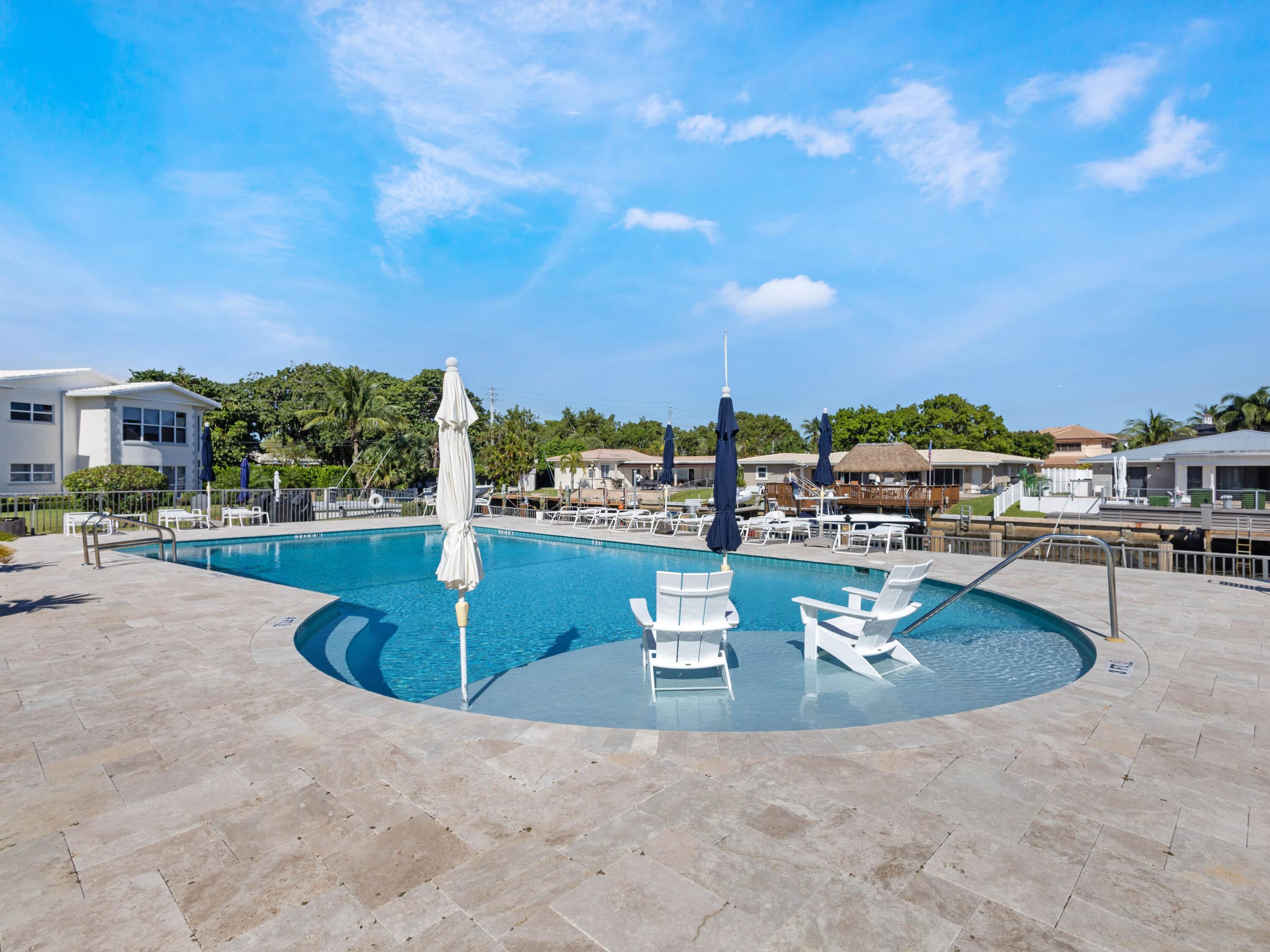 701 Harbour Drive, Unit 2140 Boca Raton, FL 33431 - Photo 25 of 35 a view of a swimming pool with a patio