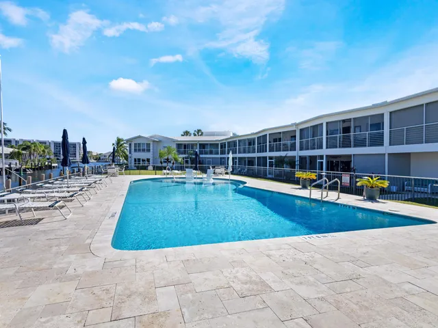 a view of a swimming pool with a lounge chair