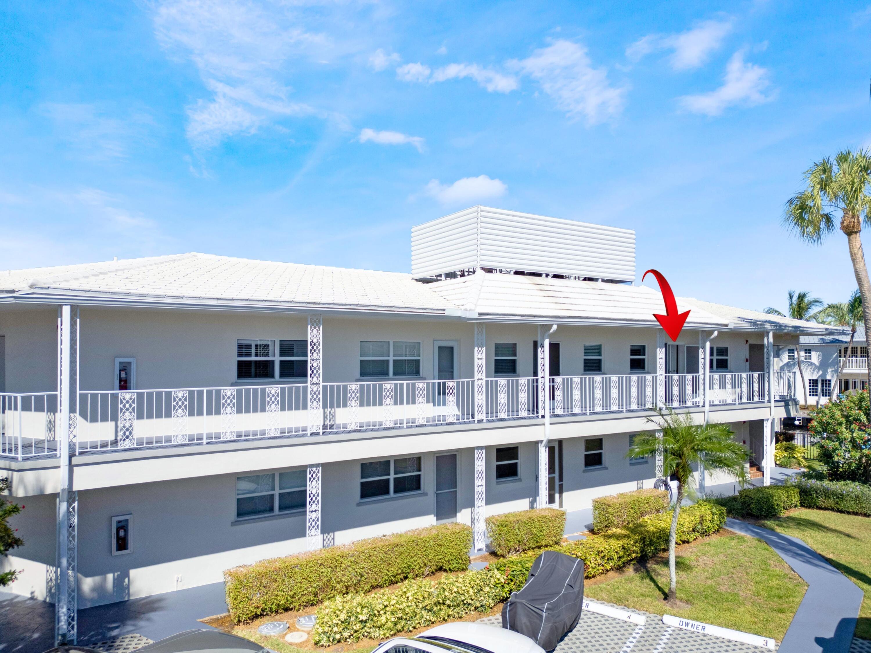 701 Harbour Drive, Unit 2140 Boca Raton, FL 33431 - Photo 28 of 35 a view of a building with a garden and potted plants