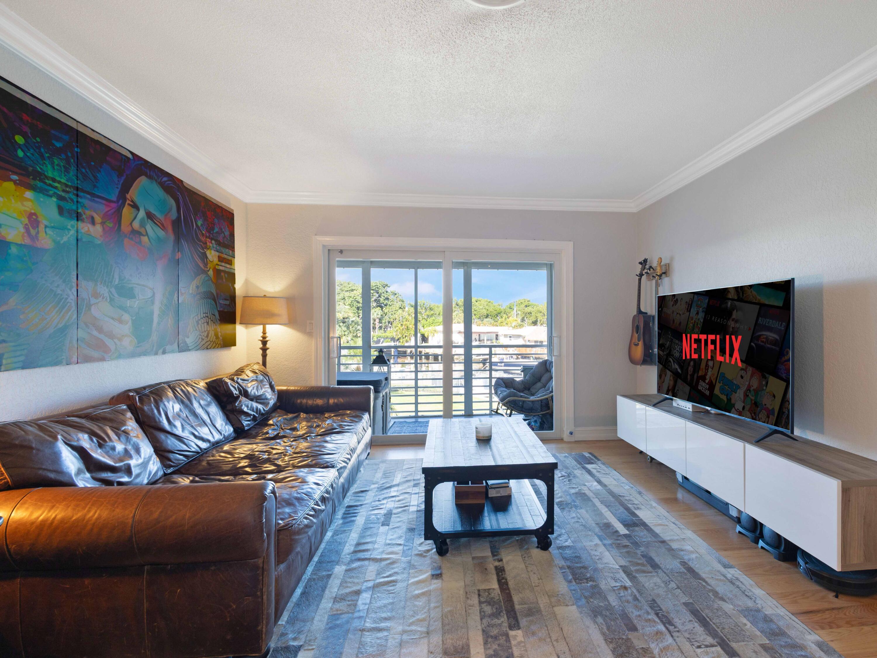 701 Harbour Drive, Unit 2140 Boca Raton, FL 33431 - Photo 9 of 35 a living room with furniture and a flat screen tv