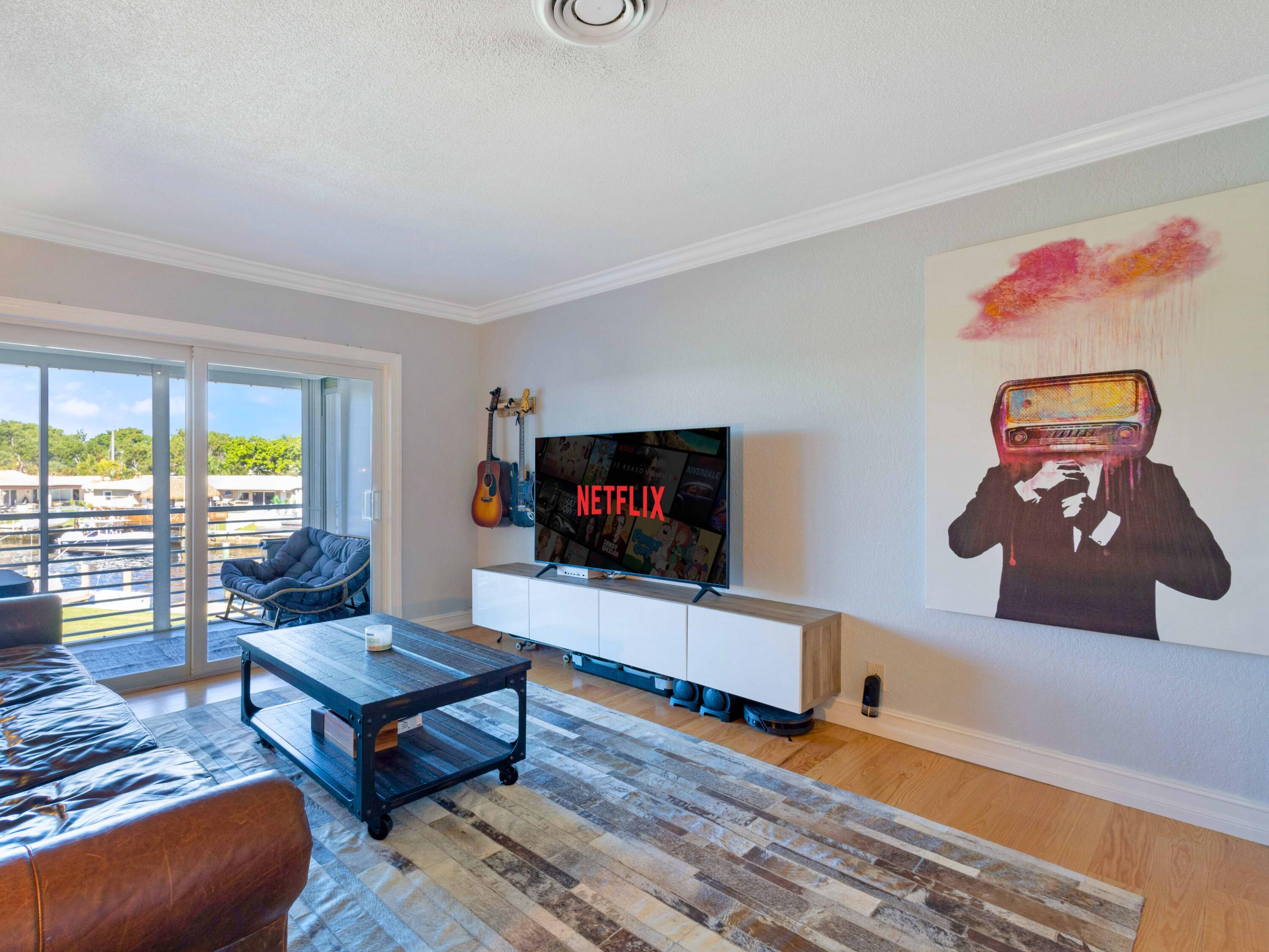 701 Harbour Drive, Unit 2140 Boca Raton, FL 33431 - Photo 10 of 35 a living room with furniture and a flat screen tv