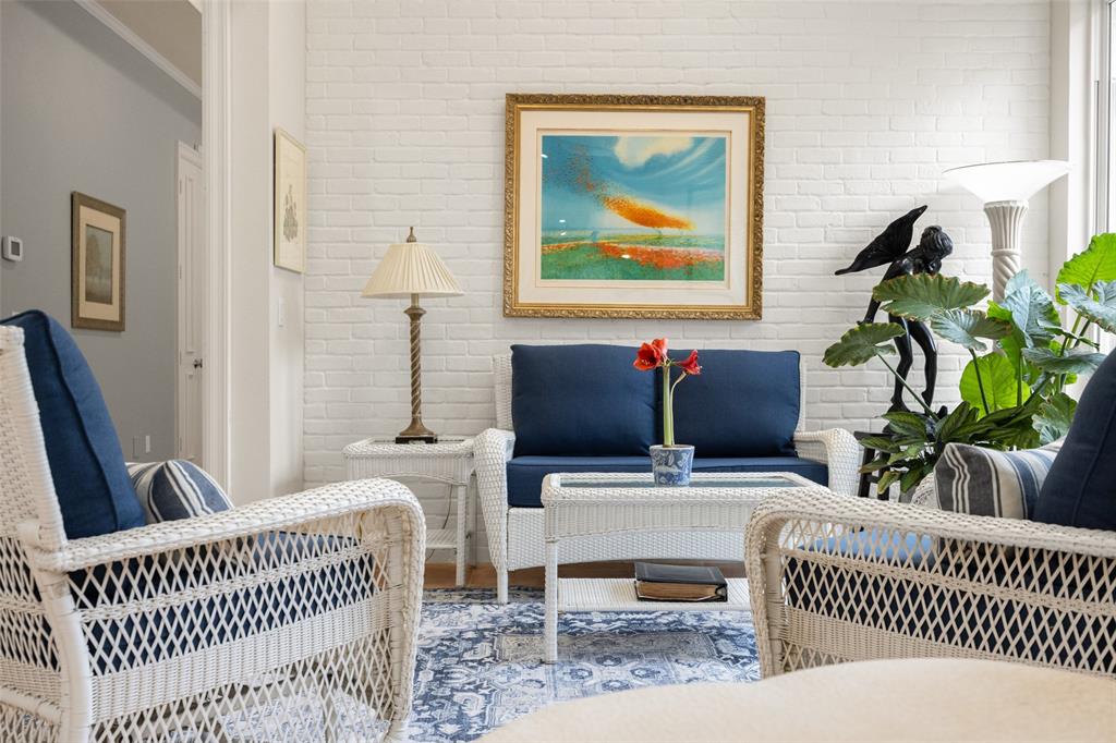 14725 Celestial Place Addison, TX 75254 - Photo 24 of 38 a living room with furniture and a potted plant