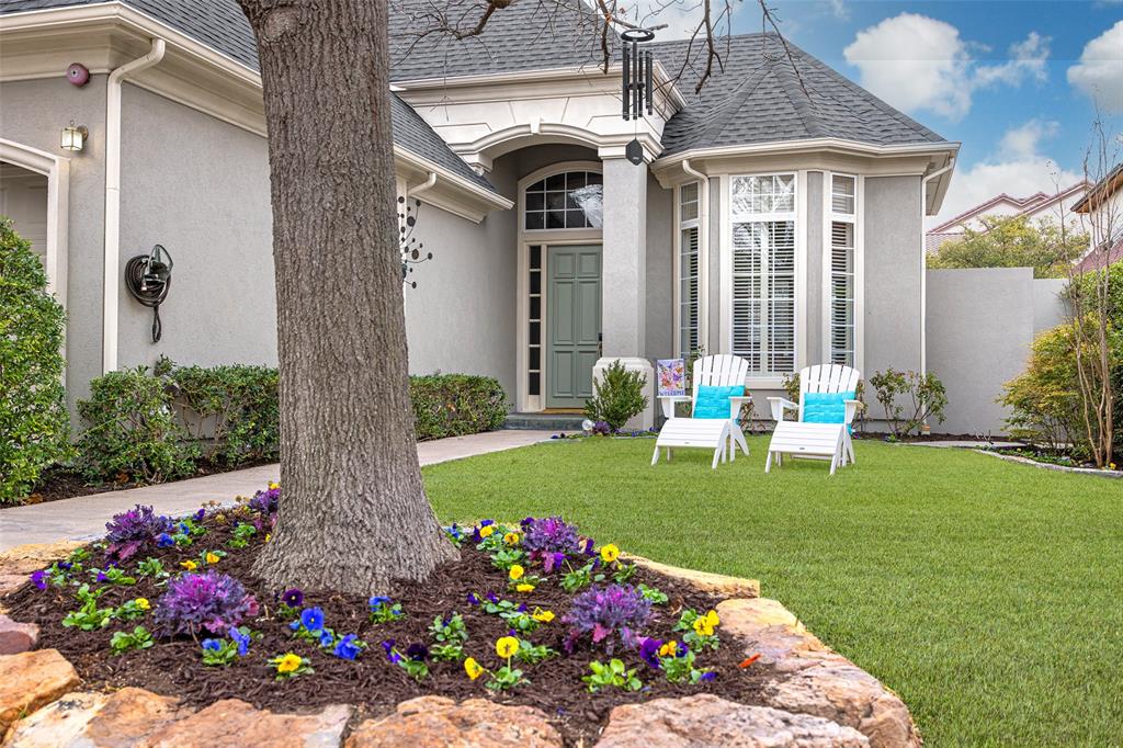 14725 Celestial Place Addison, TX 75254 - Photo 3 of 38 a front view of a house with a big yard and a fountain