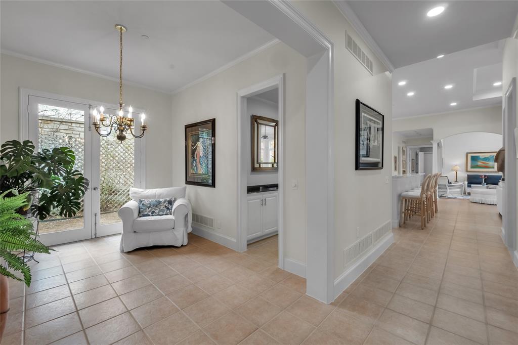 14725 Celestial Place Addison, TX 75254 - Photo 8 of 38 a living room with furniture and a chandelier