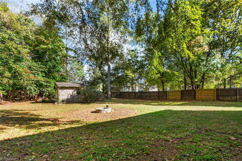3522 Hunting Ridge Drive High Point, NC 27265 - Photo 35 of 38 Fenced in Backyard with Fire Pit