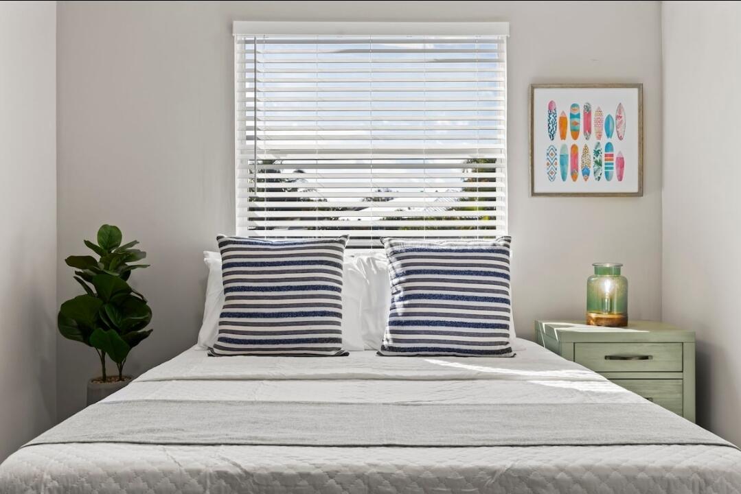 5607 Tangelo Drive Fort Pierce, FL 34982 - Photo 3 of 10 a view of a hallway with wooden floor and a potted plant
