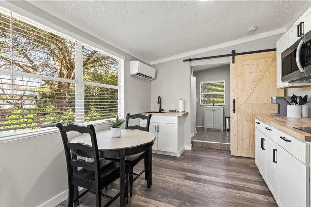 a view of a dining room with furniture window and wooden floor