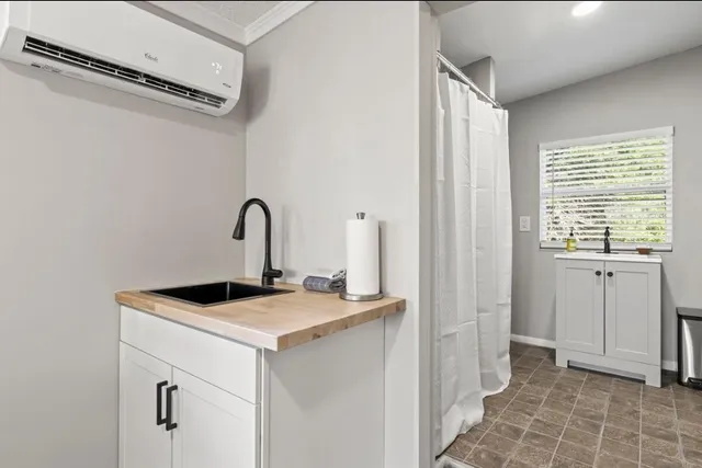 a room with a sink and a window