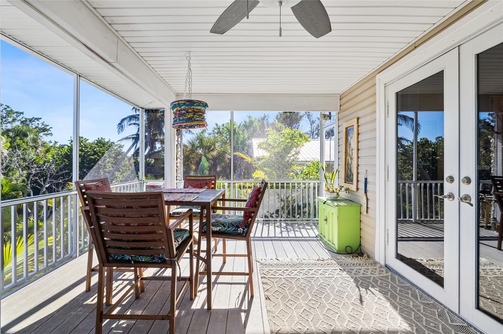 8550 Little Gasparilla Placida, FL 33946 - Photo 11 of 62 a patio with table and chairs and potted plants