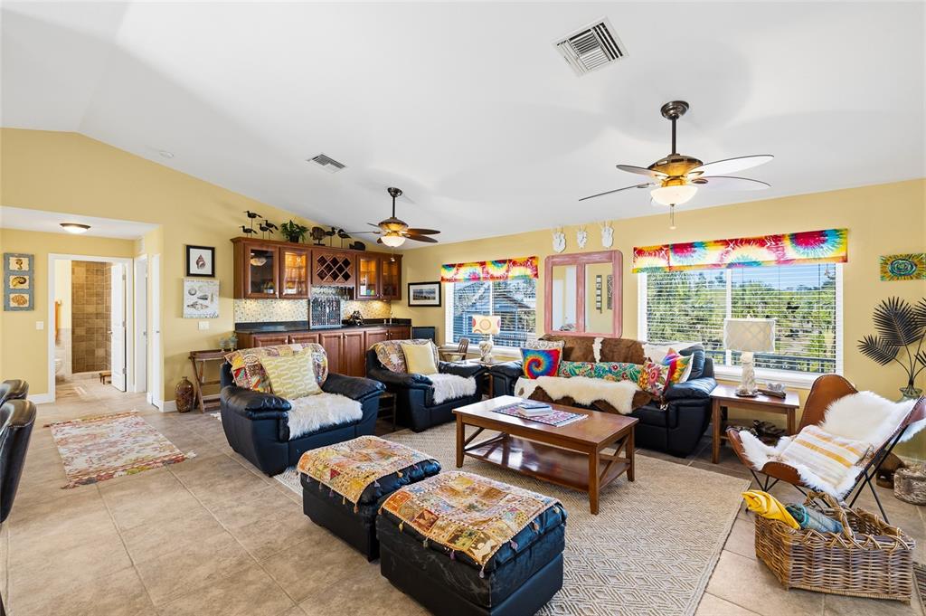 8550 Little Gasparilla Placida, FL 33946 - Photo 21 of 62 a living room with furniture ceiling fan and a window