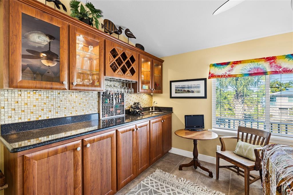 8550 Little Gasparilla Placida, FL 33946 - Photo 25 of 62 a kitchen with stainless steel appliances granite countertop a stove a sink and a microwave