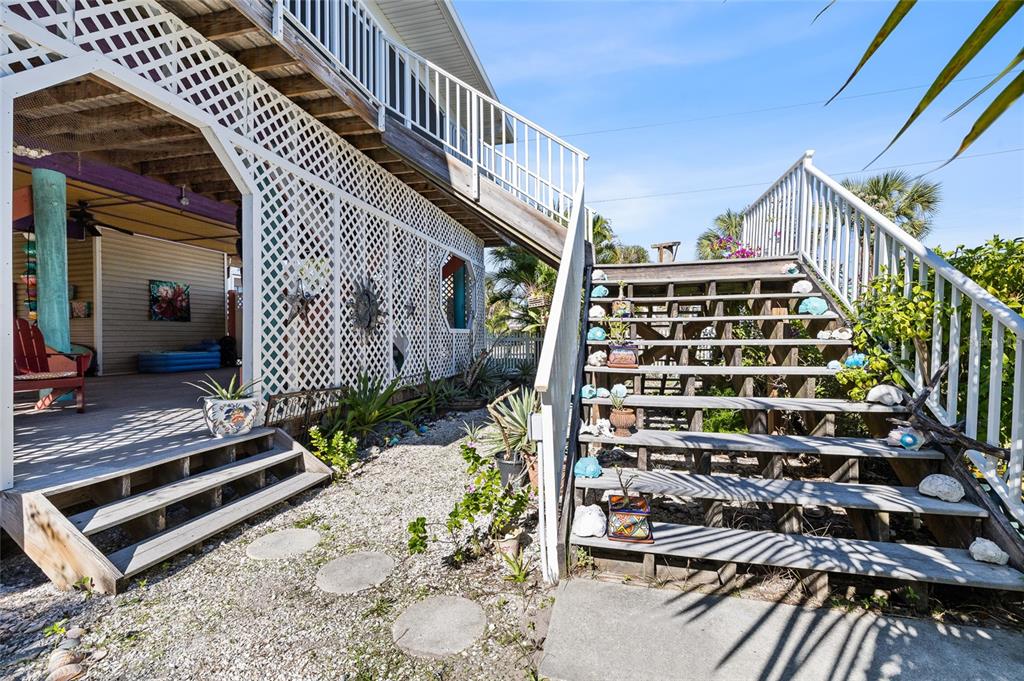 8550 Little Gasparilla Placida, FL 33946 - Photo 39 of 62 a view of balcony with wooden floor and fence