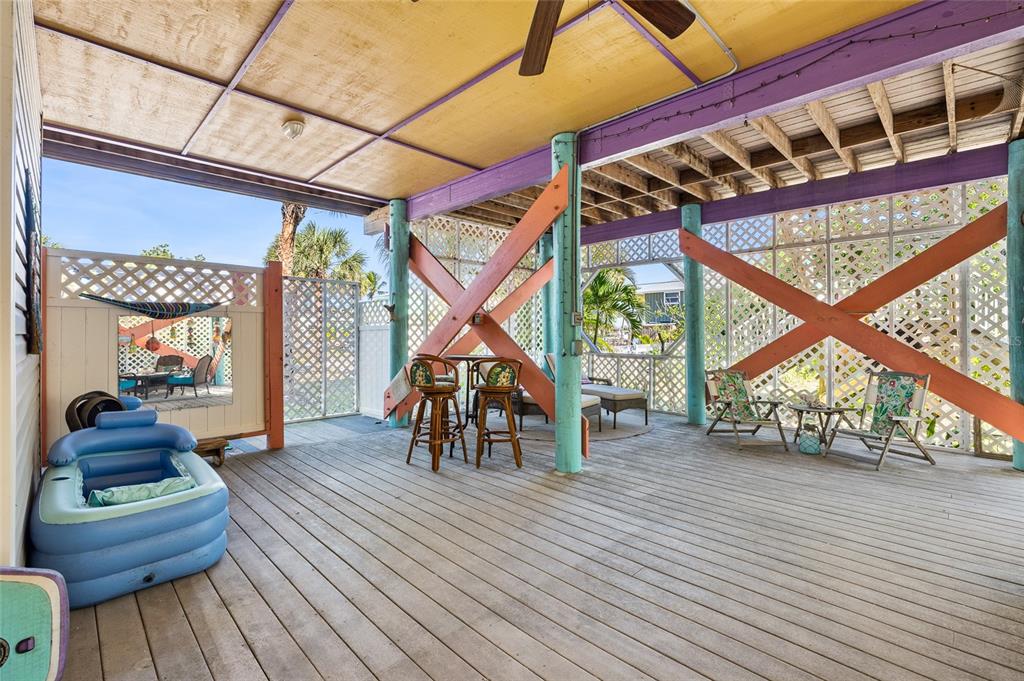 8550 Little Gasparilla Placida, FL 33946 - Photo 43 of 62 a dining room with wooden floor and furniture