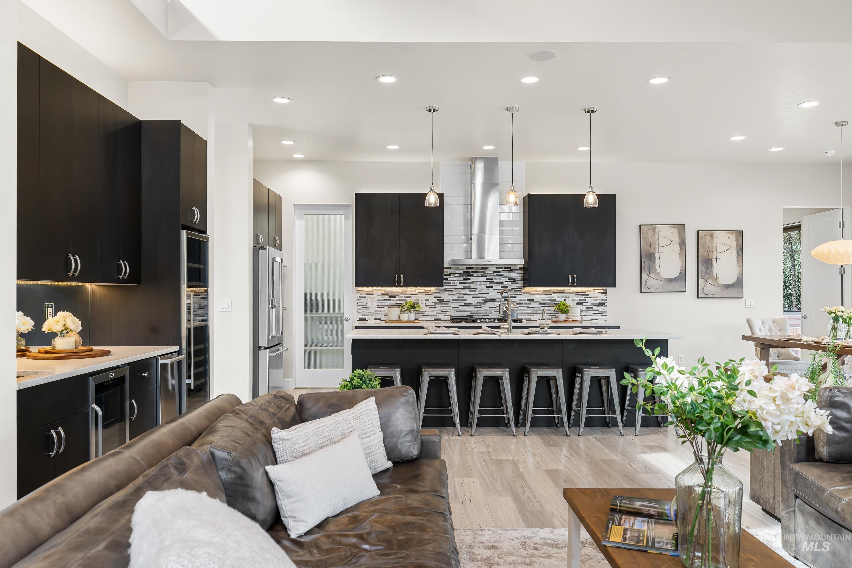 3672 West Red Jade Court Meridian, ID 83646 - Photo 11 of 50 Living area with light wood finished floors, recessed lighting, and beverage cooler