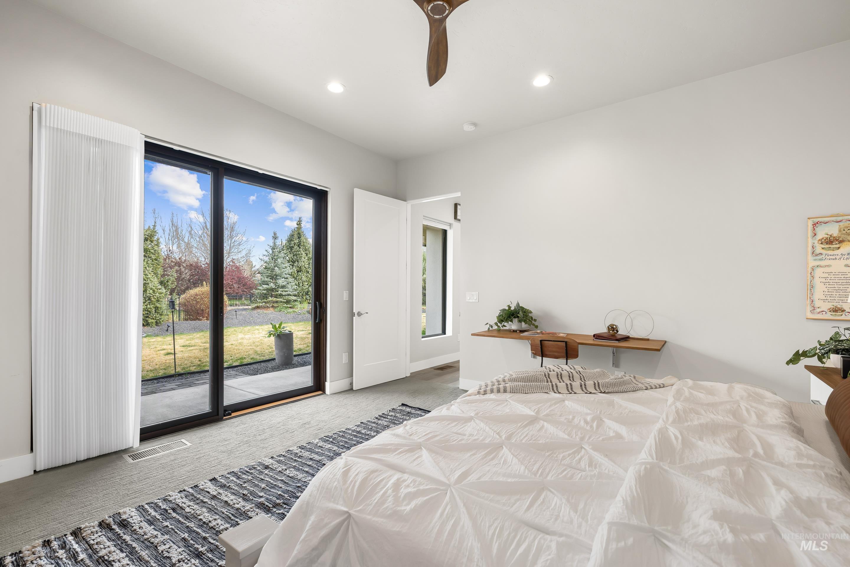 3672 West Red Jade Court Meridian, ID 83646 - Photo 20 of 50 Bedroom with light colored carpet, access to exterior, a ceiling fan, and recessed lighting