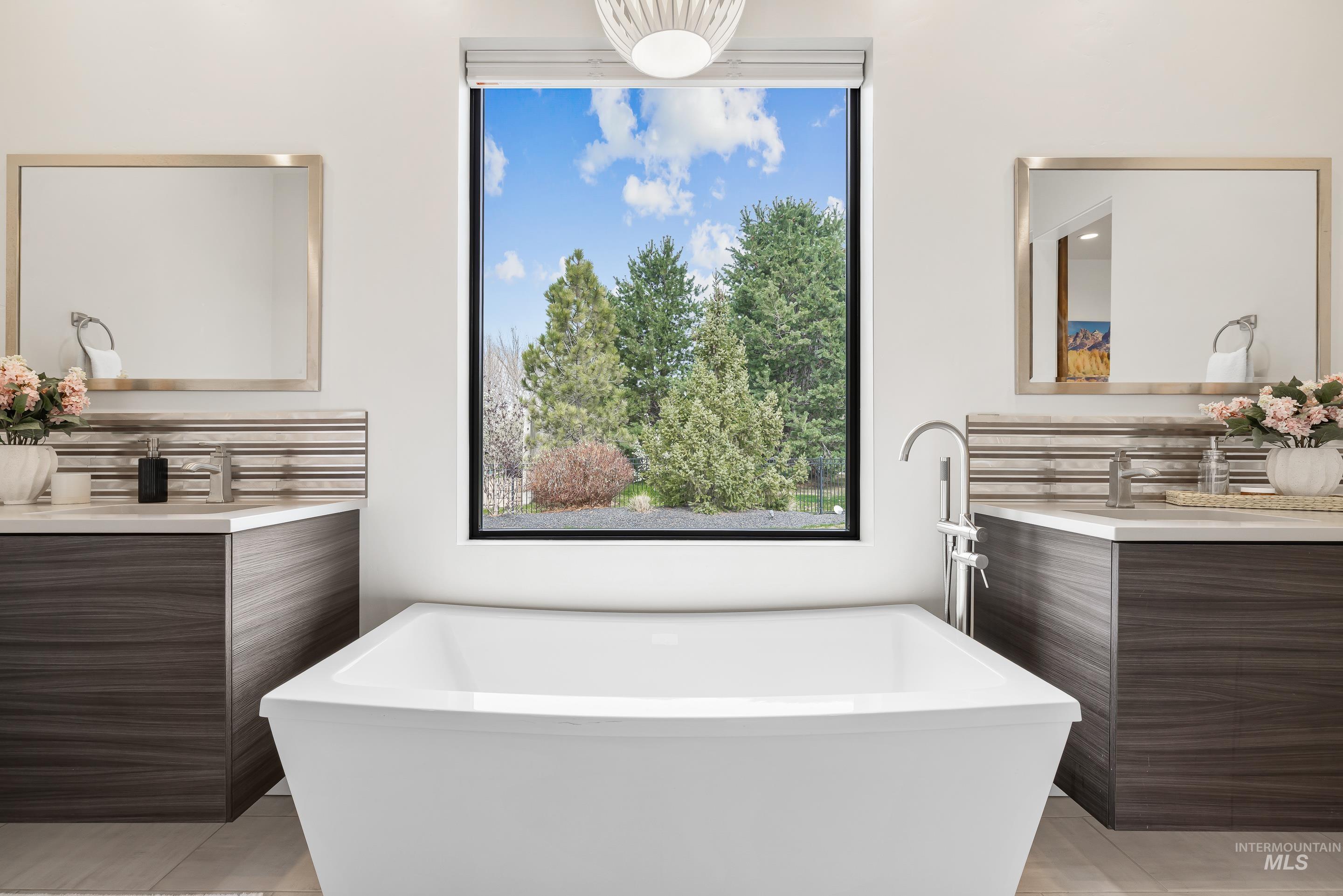 3672 West Red Jade Court Meridian, ID 83646 - Photo 23 of 50 Bathroom featuring vanity and a freestanding tub