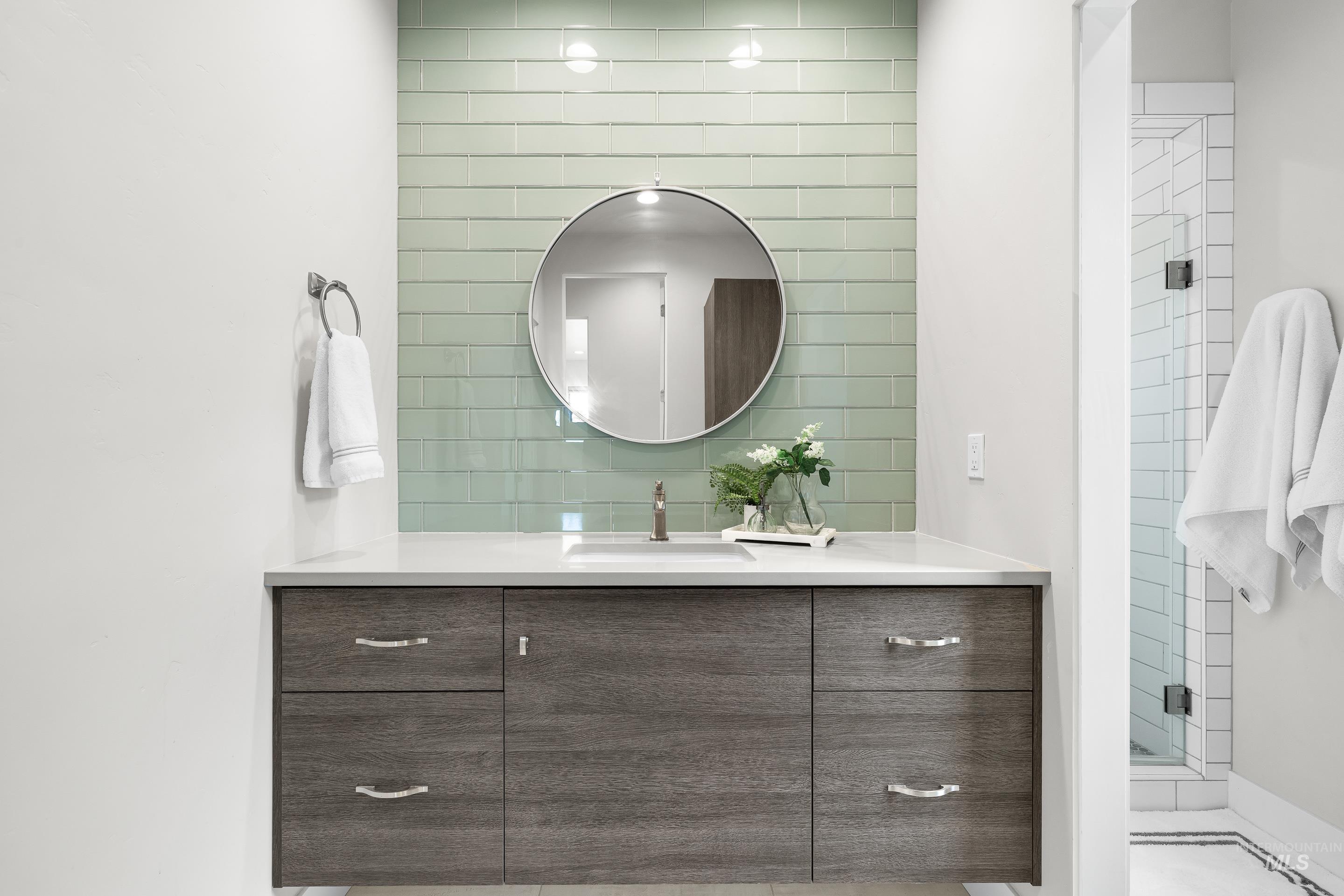 3672 West Red Jade Court Meridian, ID 83646 - Photo 27 of 50 Full bathroom featuring vanity, a shower stall, and decorative backsplash