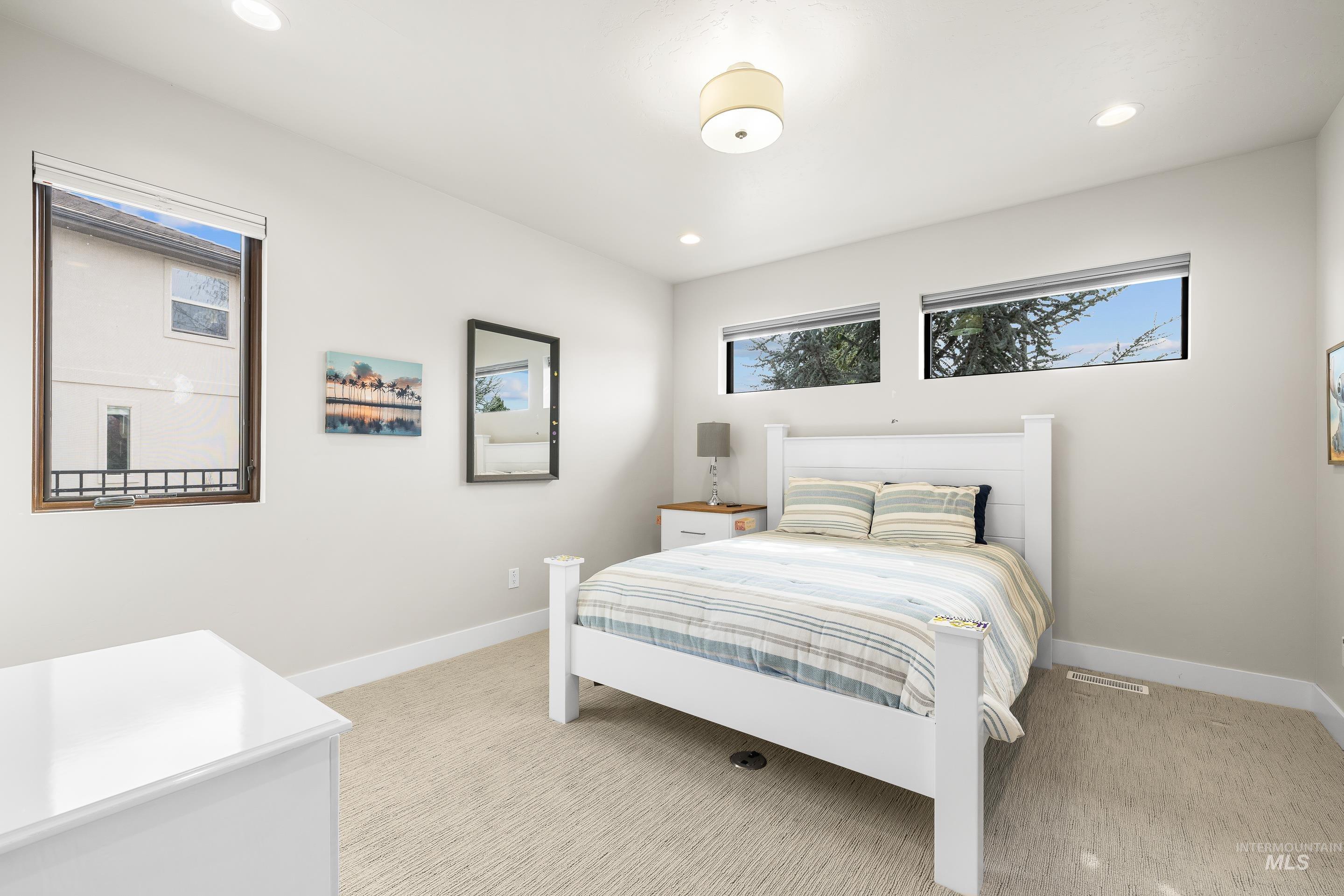 3672 West Red Jade Court Meridian, ID 83646 - Photo 28 of 50 Bedroom with light colored carpet and recessed lighting