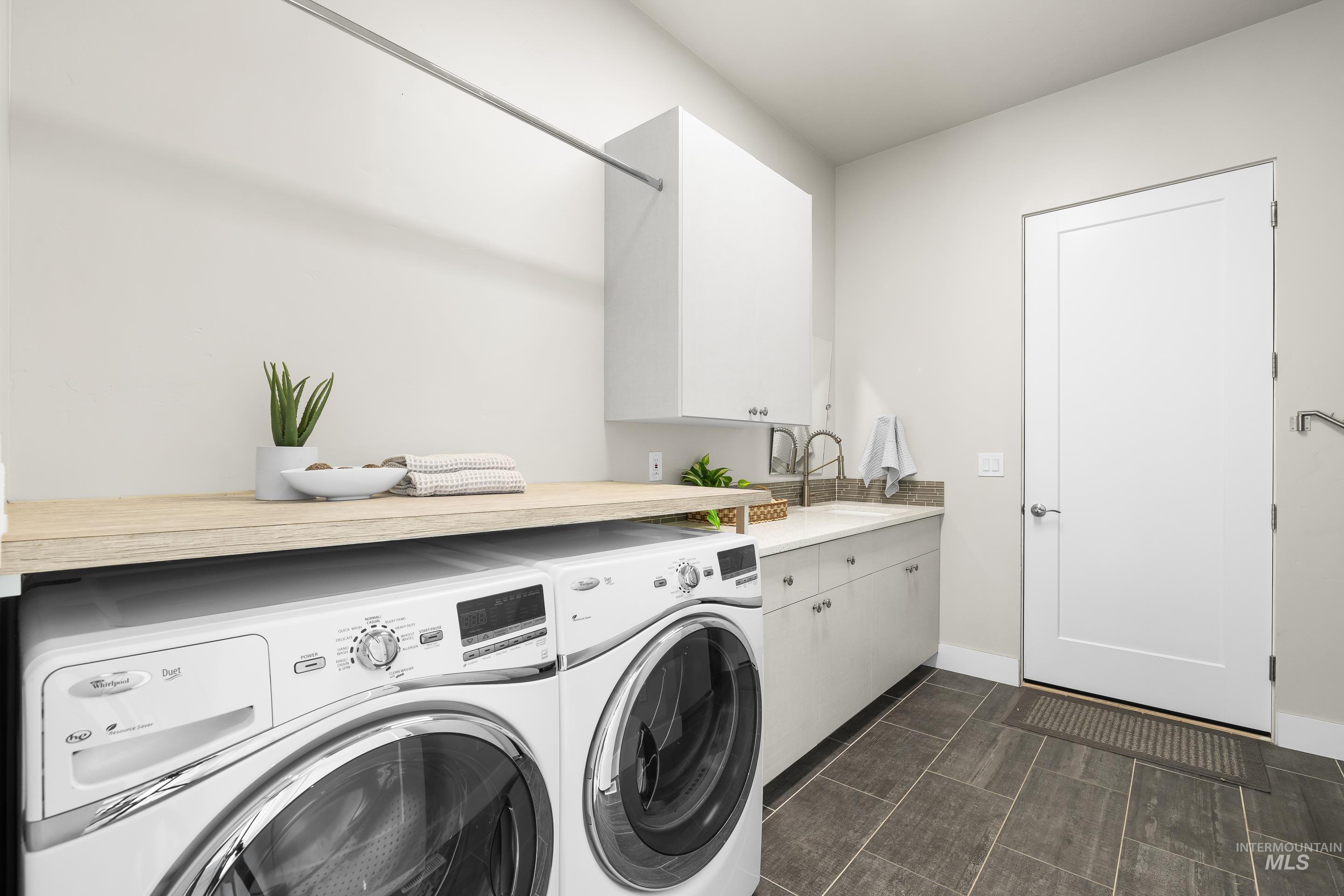 3672 West Red Jade Court Meridian, ID 83646 - Photo 29 of 50 Laundry room featuring independent washer and dryer and cabinet space