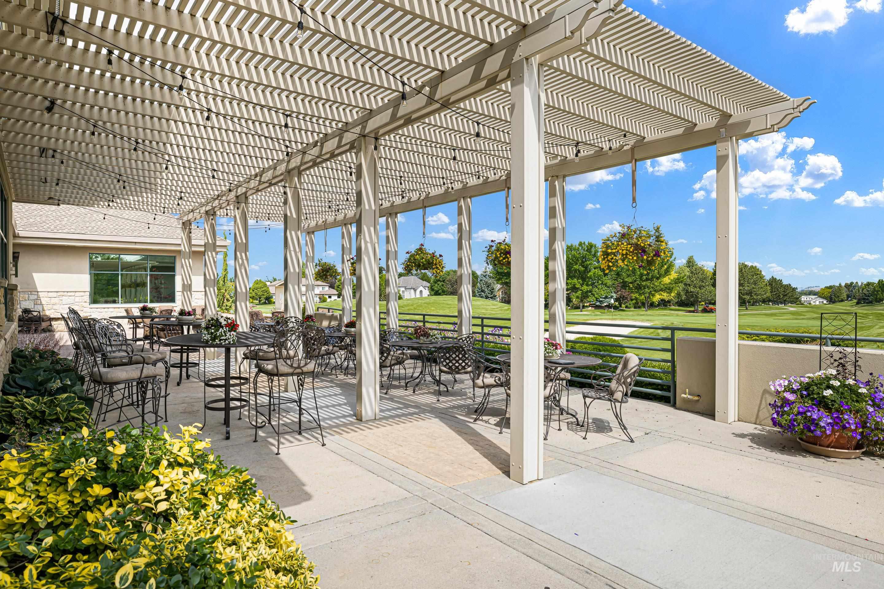 3672 West Red Jade Court Meridian, ID 83646 - Photo 41 of 50 View of patio with outdoor dining area, view of golf course, and a pergola