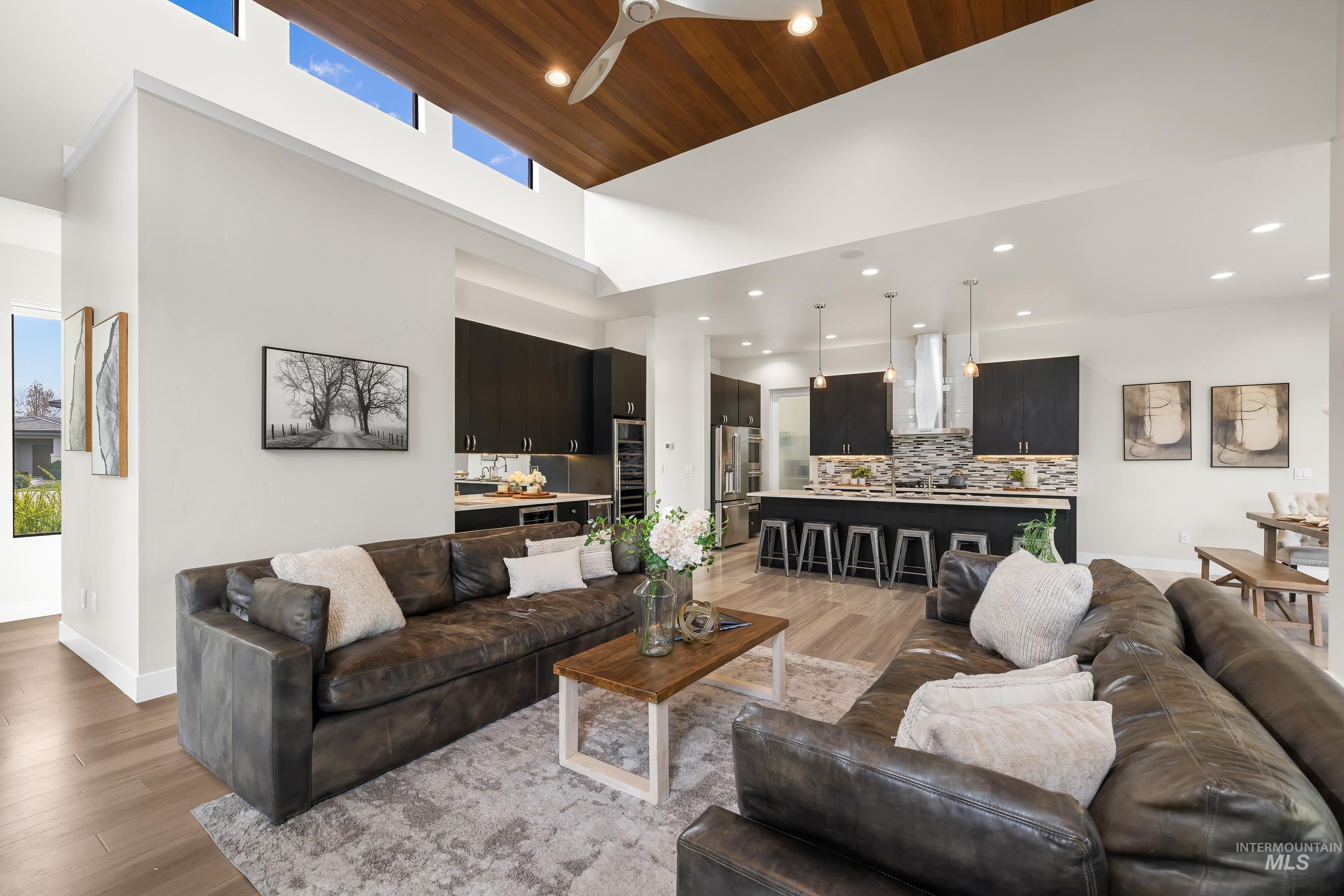 3672 West Red Jade Court Meridian, ID 83646 - Photo 8 of 50 Living room featuring light wood finished floors, ceiling fan, a high wooden ceiling, and recessed lighting
