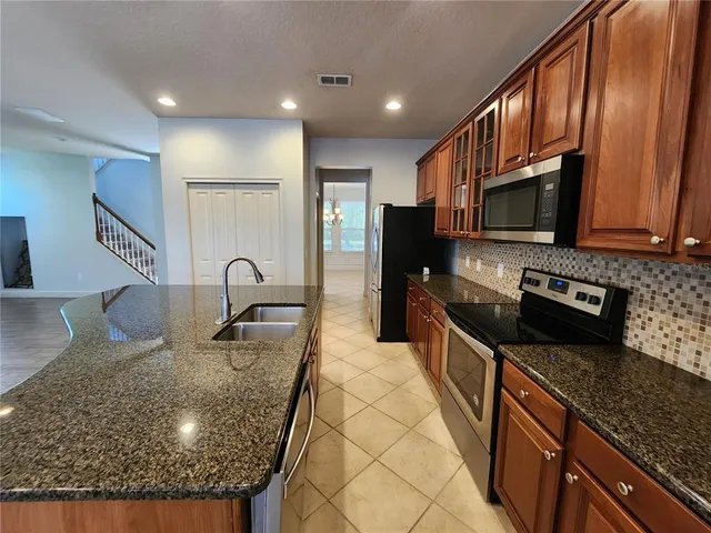 a view of an empty room with a bathroom