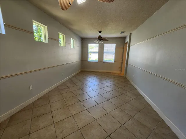 a view of an empty room and window