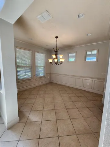 a view of a livingroom with wooden floor and a window