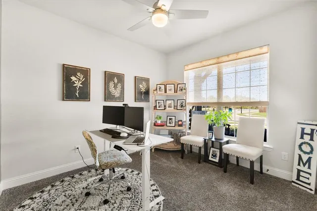 a workspace with furniture and window