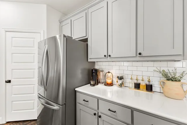 a kitchen with appliances and cabinets