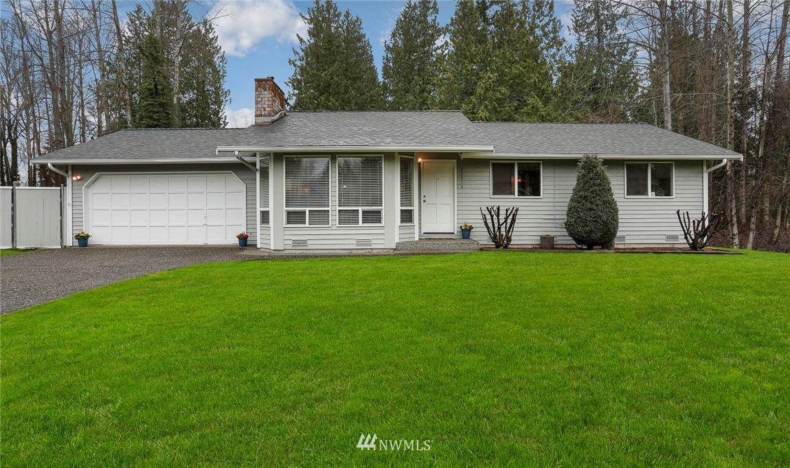 22515 20th Avenue Southeast Bothell, WA 98021 - Photo 1 of 34 a front view of a house with a yard and sitting area