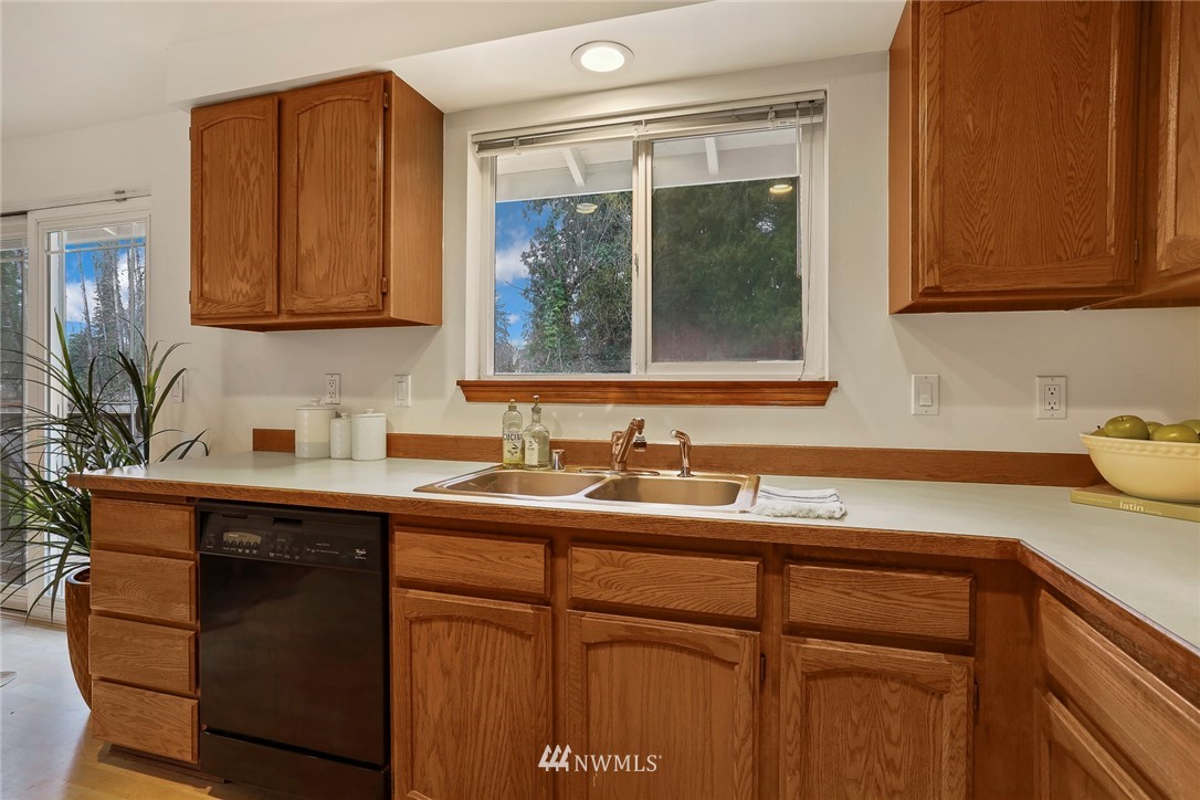 22515 20th Avenue Southeast Bothell, WA 98021 - Photo 15 of 34 a kitchen with a sink and cabinets