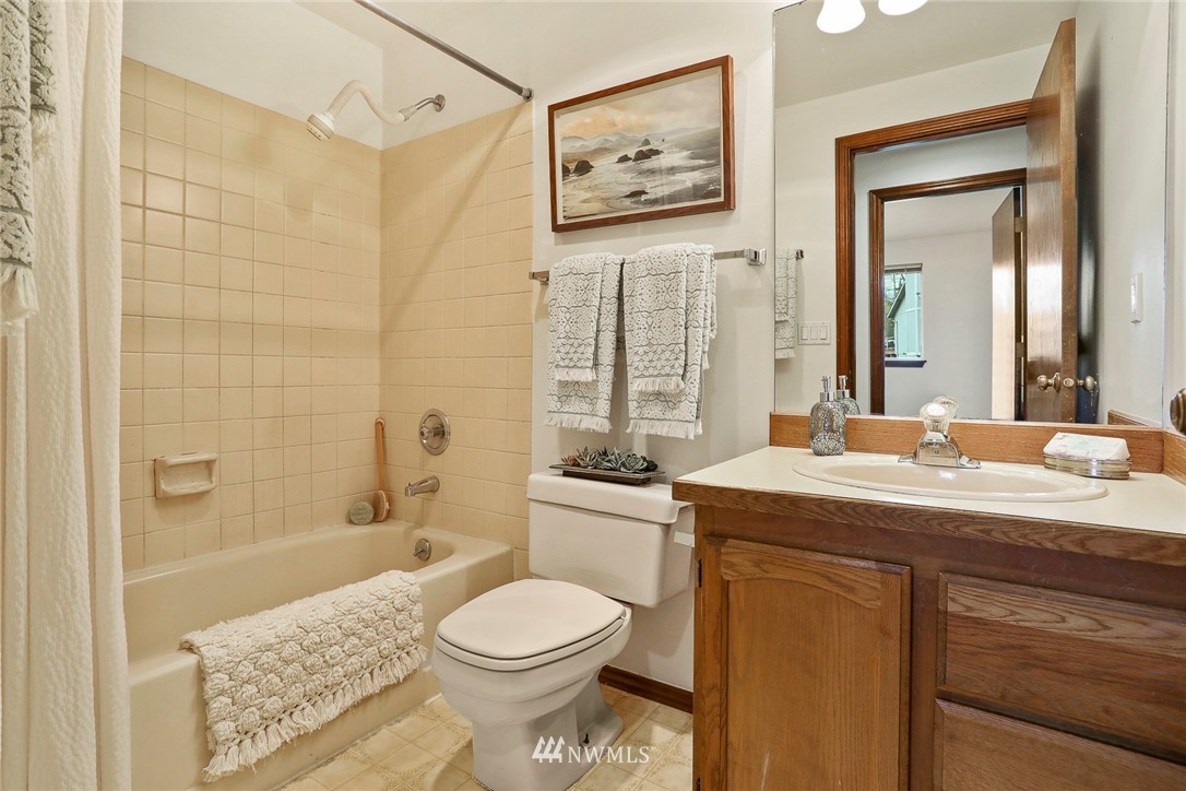 22515 20th Avenue Southeast Bothell, WA 98021 - Photo 17 of 34 a bathroom with a sink a toilet and shower