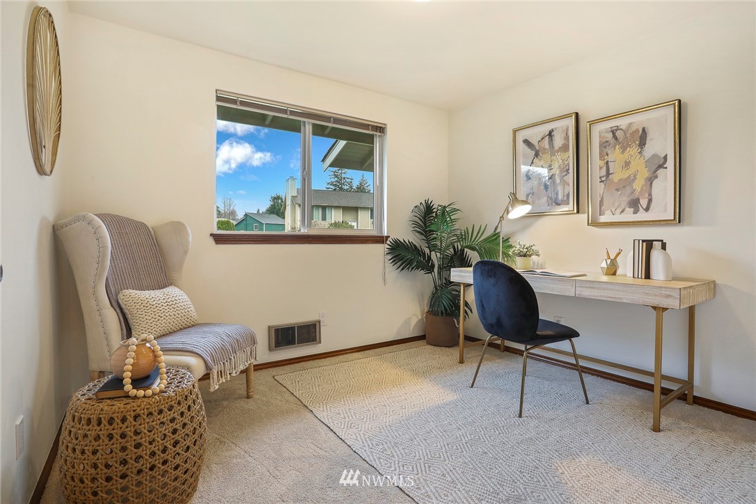 22515 20th Avenue Southeast Bothell, WA 98021 - Photo 18 of 34 a living room with furniture and a window
