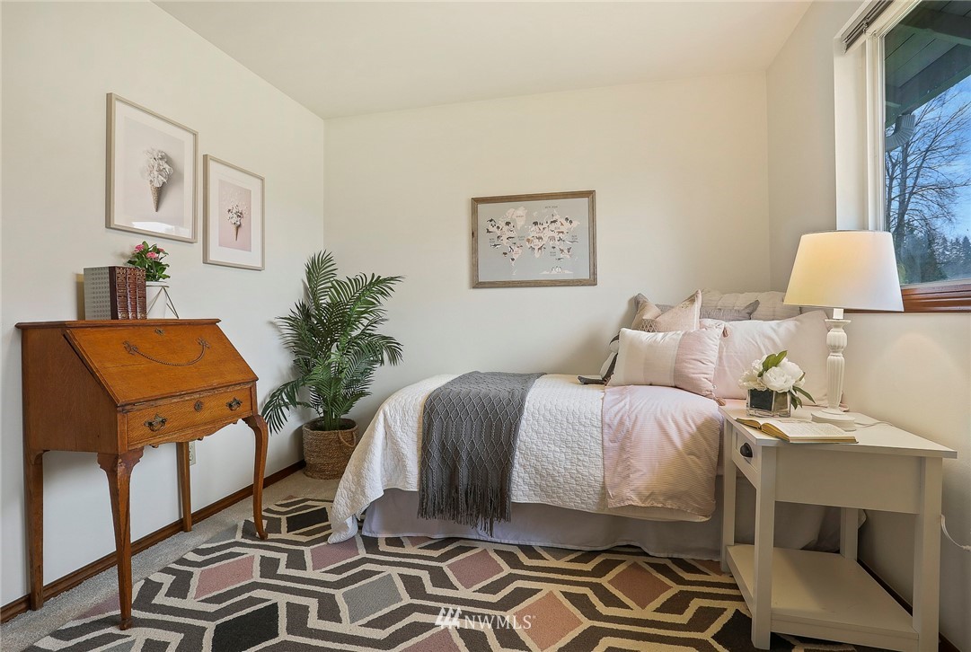 22515 20th Avenue Southeast Bothell, WA 98021 - Photo 20 of 34 a bedroom with a bed and chair