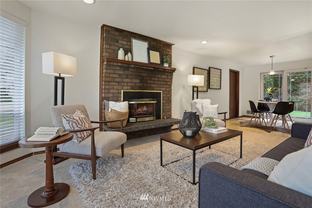 22515 20th Avenue Southeast Bothell, WA 98021 - Photo 2 of 34 a living room with furniture and a fireplace
