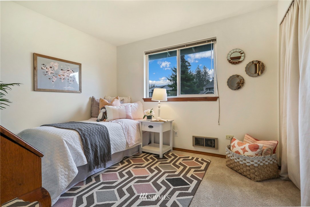 22515 20th Avenue Southeast Bothell, WA 98021 - Photo 21 of 34 a bedroom with a bed and wooden floor