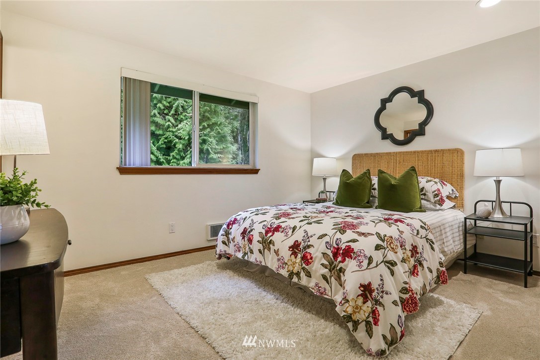 22515 20th Avenue Southeast Bothell, WA 98021 - Photo 23 of 34 a bedroom with a bed and window