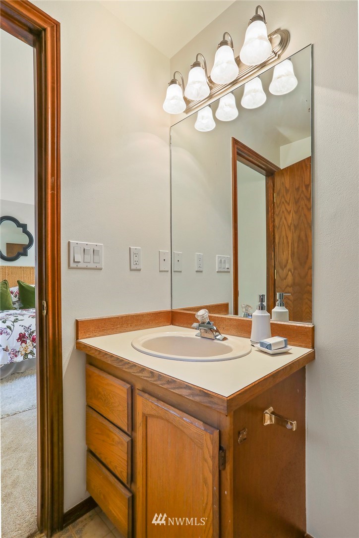 22515 20th Avenue Southeast Bothell, WA 98021 - Photo 25 of 34 a bathroom with a sink vanity and a mirror