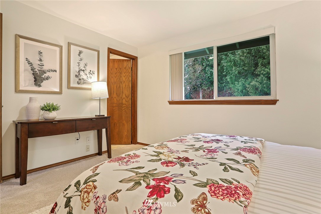 22515 20th Avenue Southeast Bothell, WA 98021 - Photo 26 of 34 a bedroom with a bed and a dresser