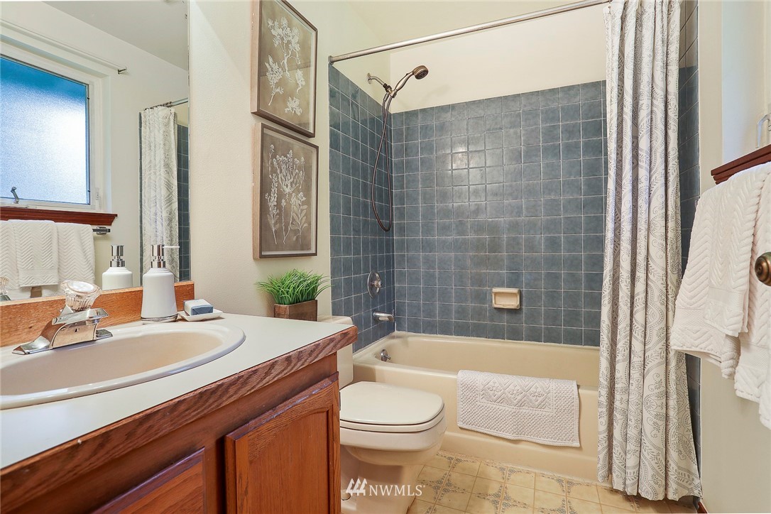 22515 20th Avenue Southeast Bothell, WA 98021 - Photo 27 of 34 a bathroom with a sink a toilet and shower
