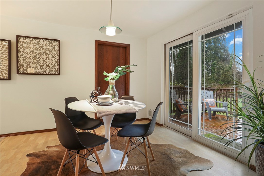 22515 20th Avenue Southeast Bothell, WA 98021 - Photo 9 of 34 a view of a dining room with furniture window and wooden floor