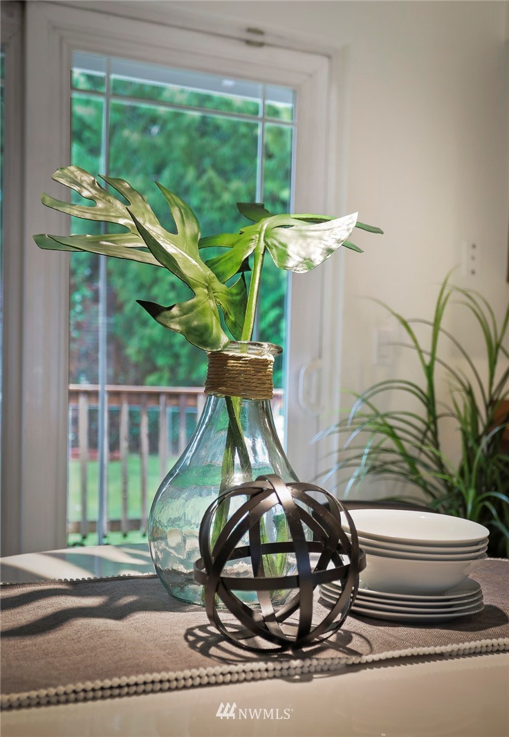 22515 20th Avenue Southeast Bothell, WA 98021 - Photo 10 of 34 a view of a porch with a dining table and chairs
