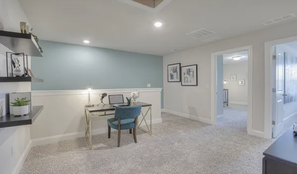 a workspace with furniture and window