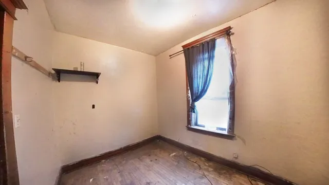 a bathroom with a sink toilet and window