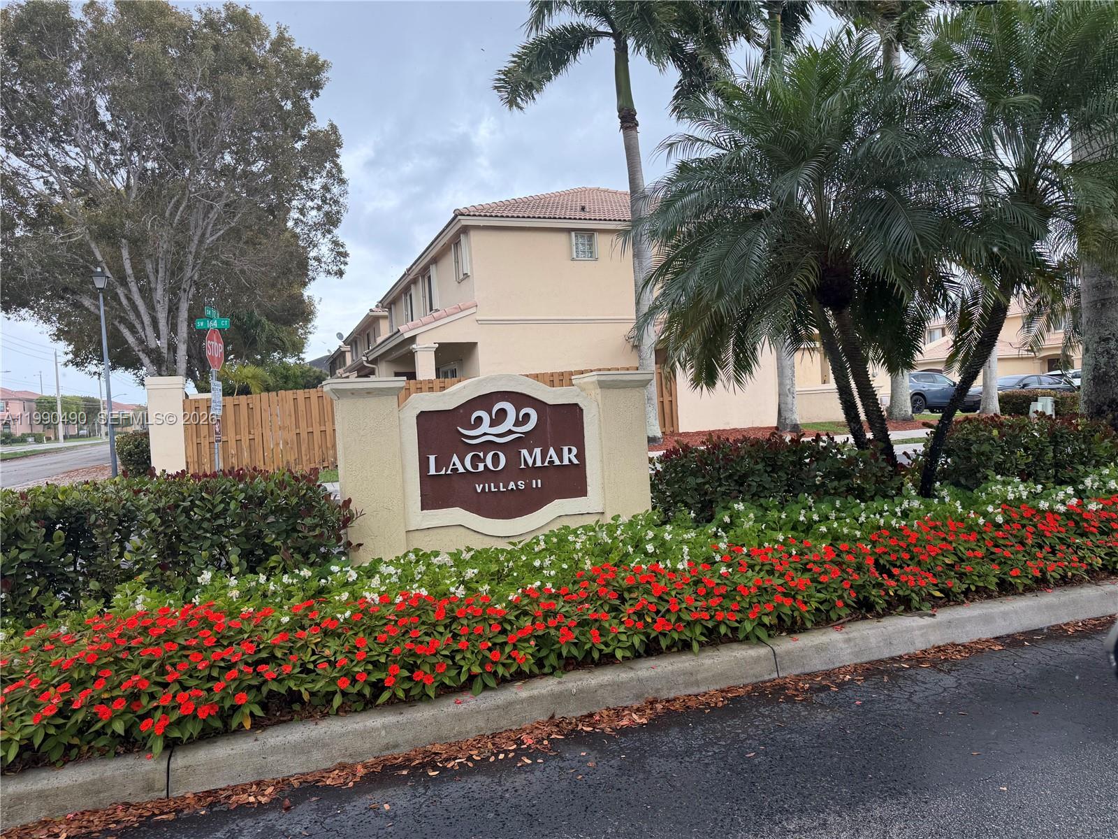 7431 Southwest 163rd Place Miami, FL 33193 - Photo 1 of 18 a sign on the side of a street