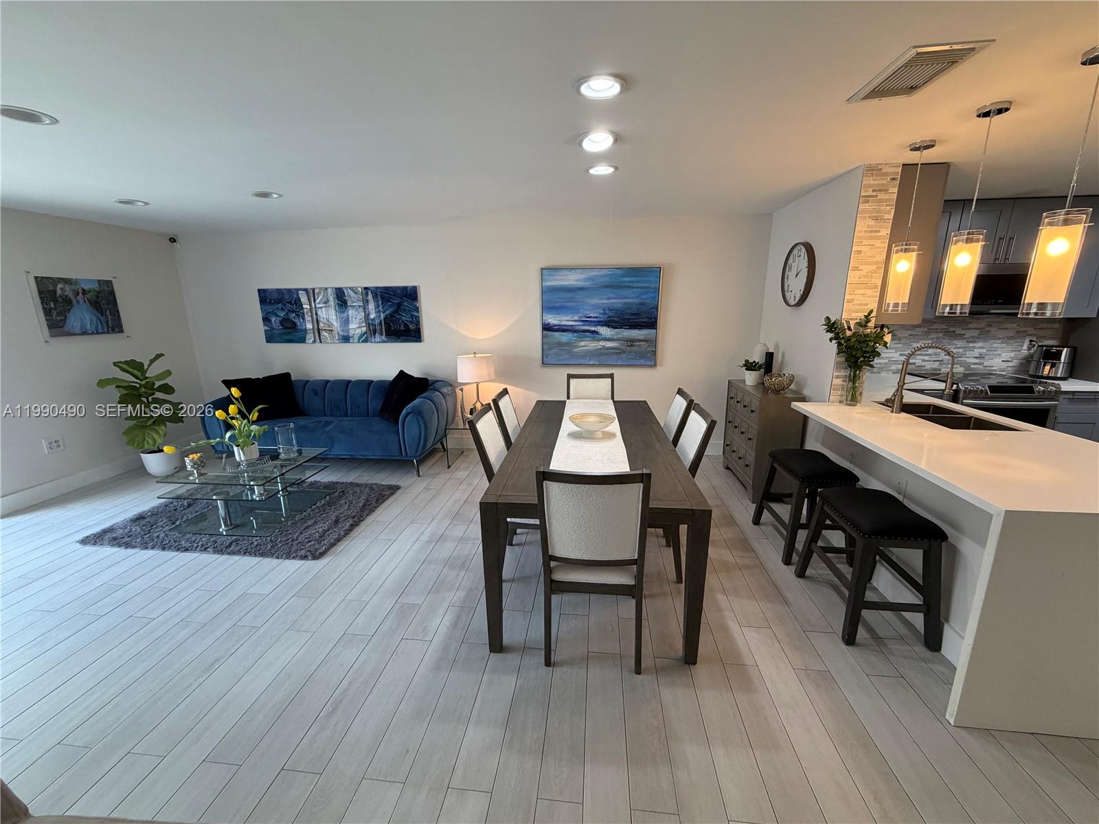 7431 Southwest 163rd Place Miami, FL 33193 - Photo 11 of 18 a view of a dining room with furniture and wooden floor