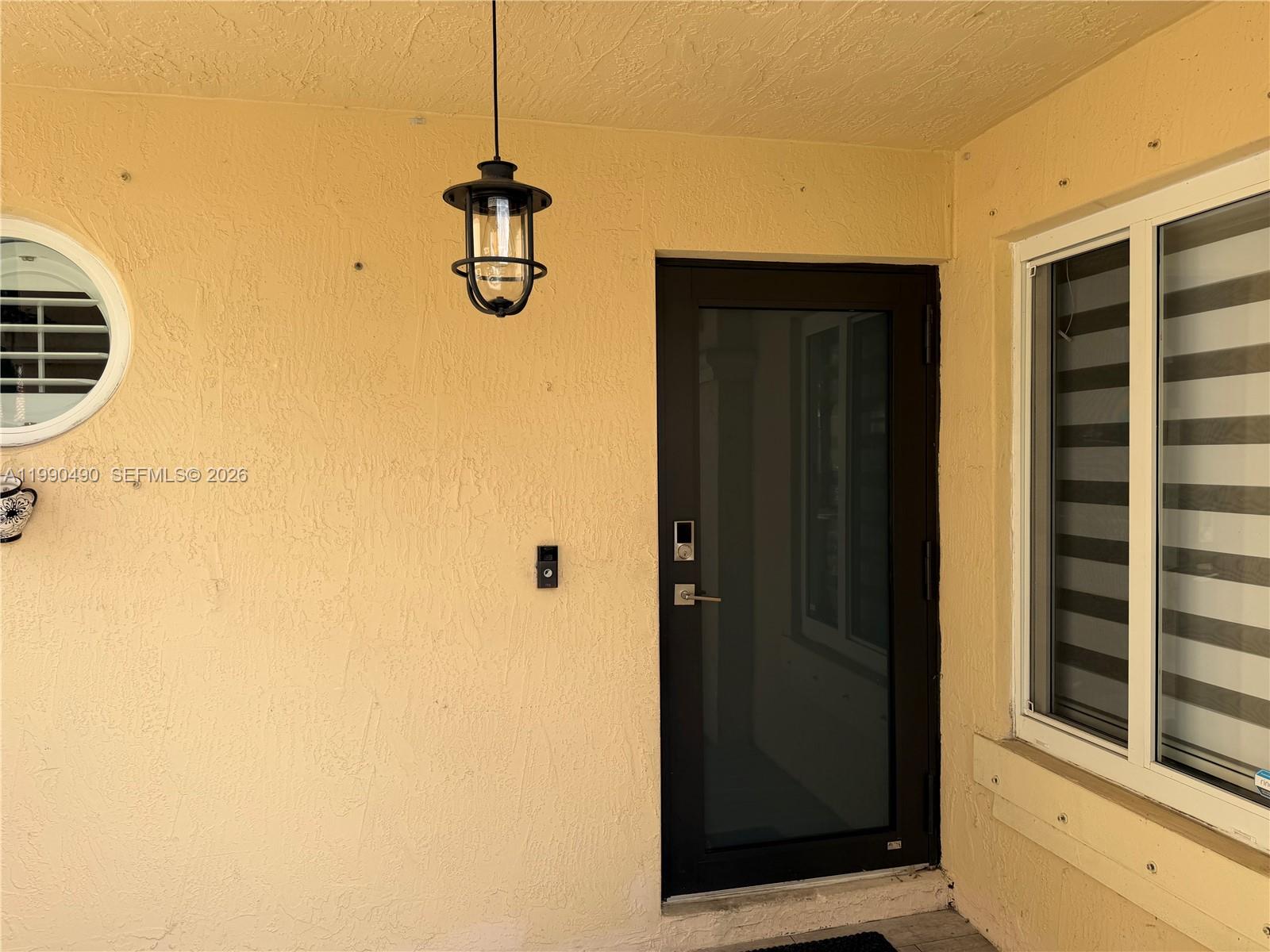 7431 Southwest 163rd Place Miami, FL 33193 - Photo 2 of 18 a view of a room with a door