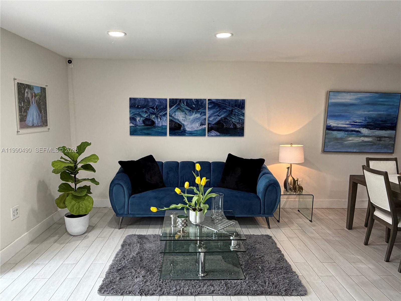 7431 Southwest 163rd Place Miami, FL 33193 - Photo 4 of 18 a living room with furniture and wooden floor