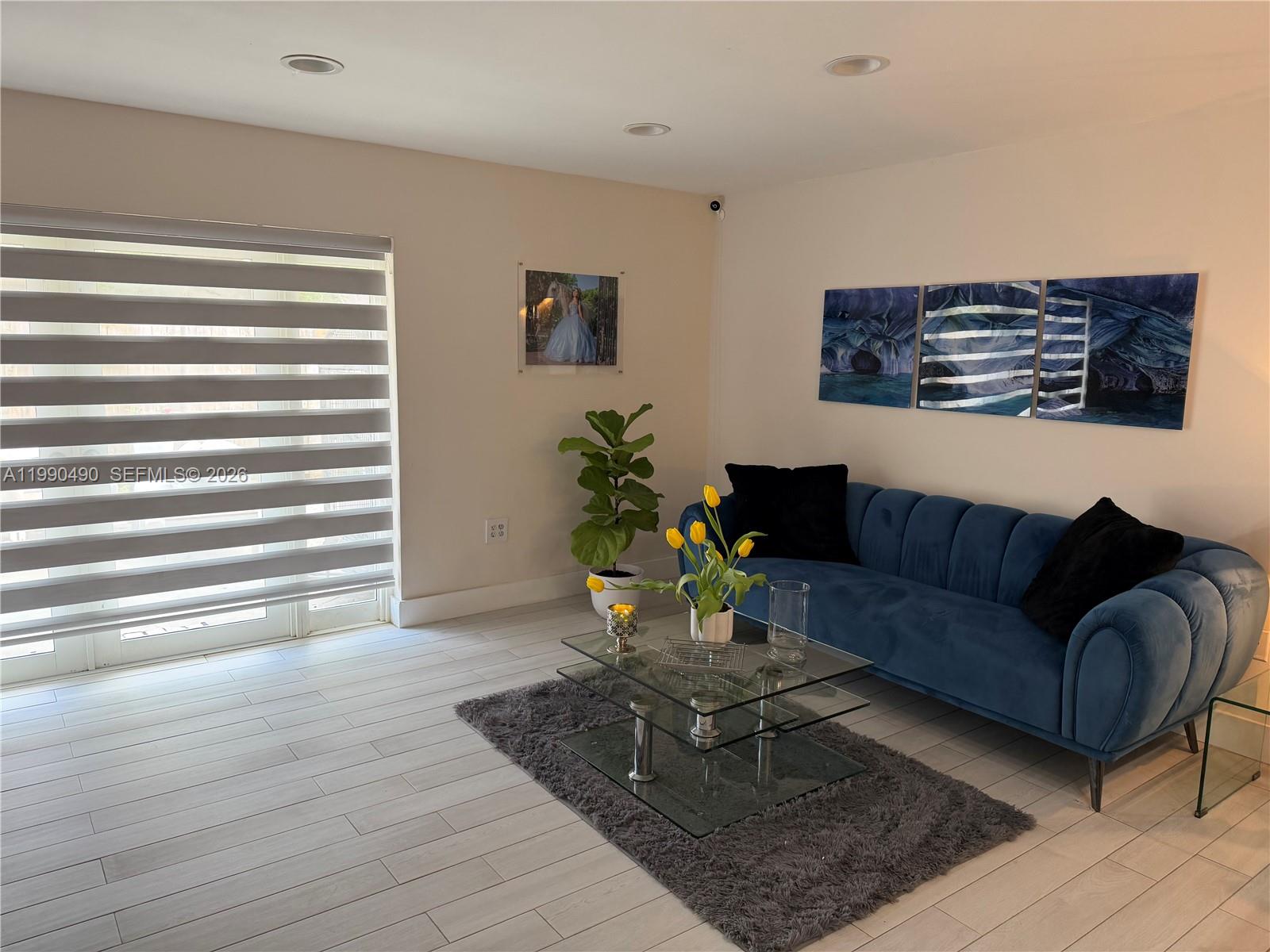7431 Southwest 163rd Place Miami, FL 33193 - Photo 5 of 18 a living room with furniture and wooden floor